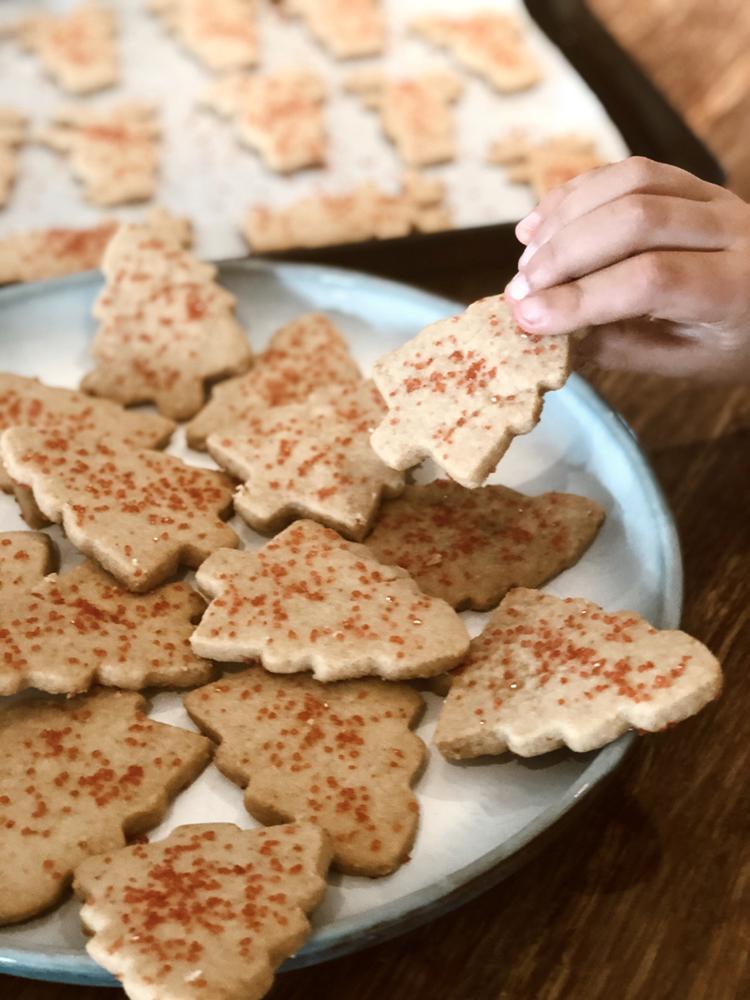 a child's hand reaches for a home made Brown Sugar Shortbread cookies 